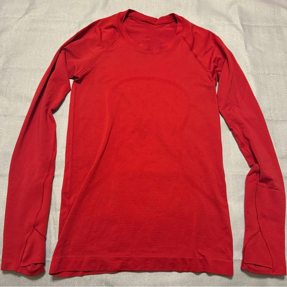 Lululemon long sleeve swiftly tech hip length red top, size 4, used